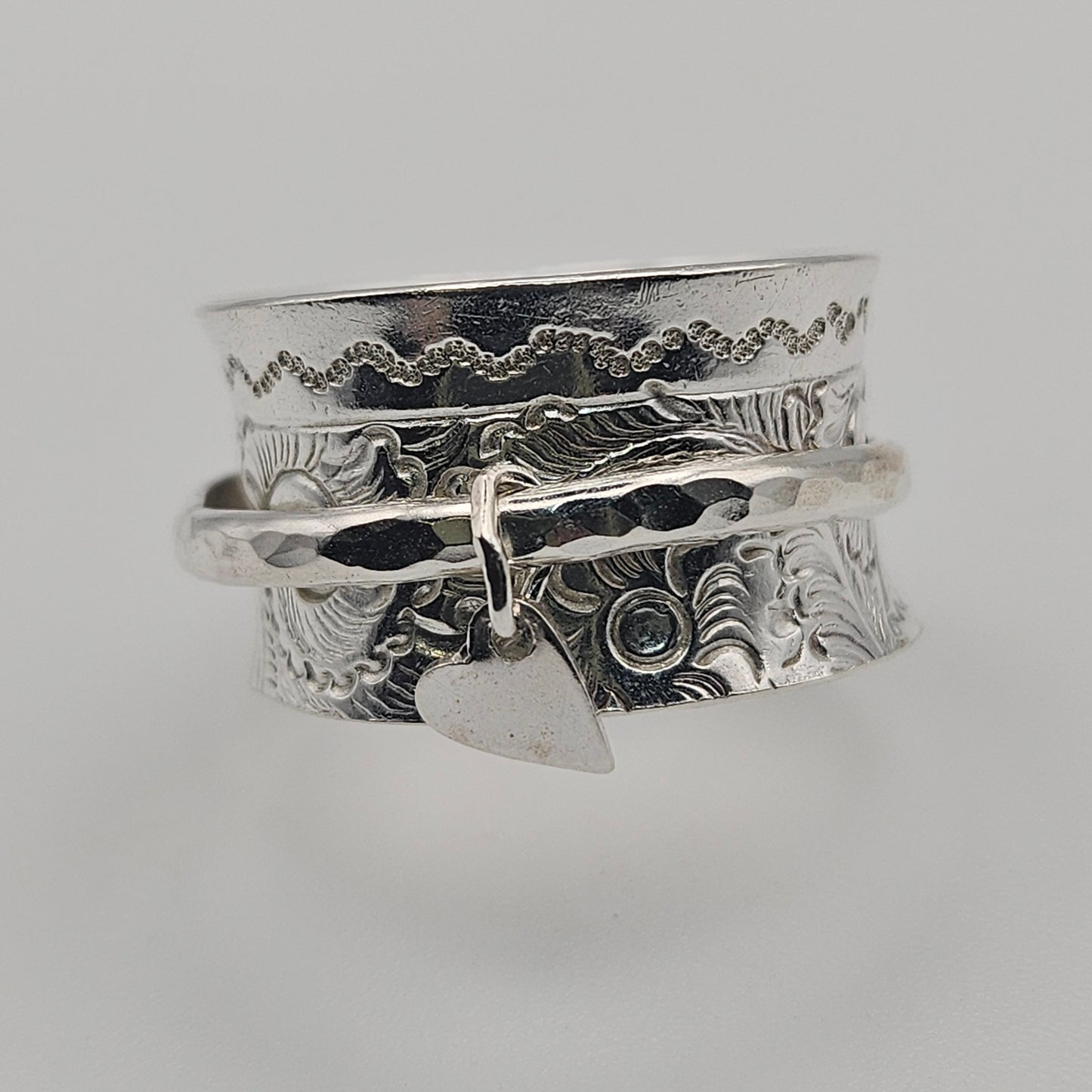 Sterling silver spinner ring. With love heart attached