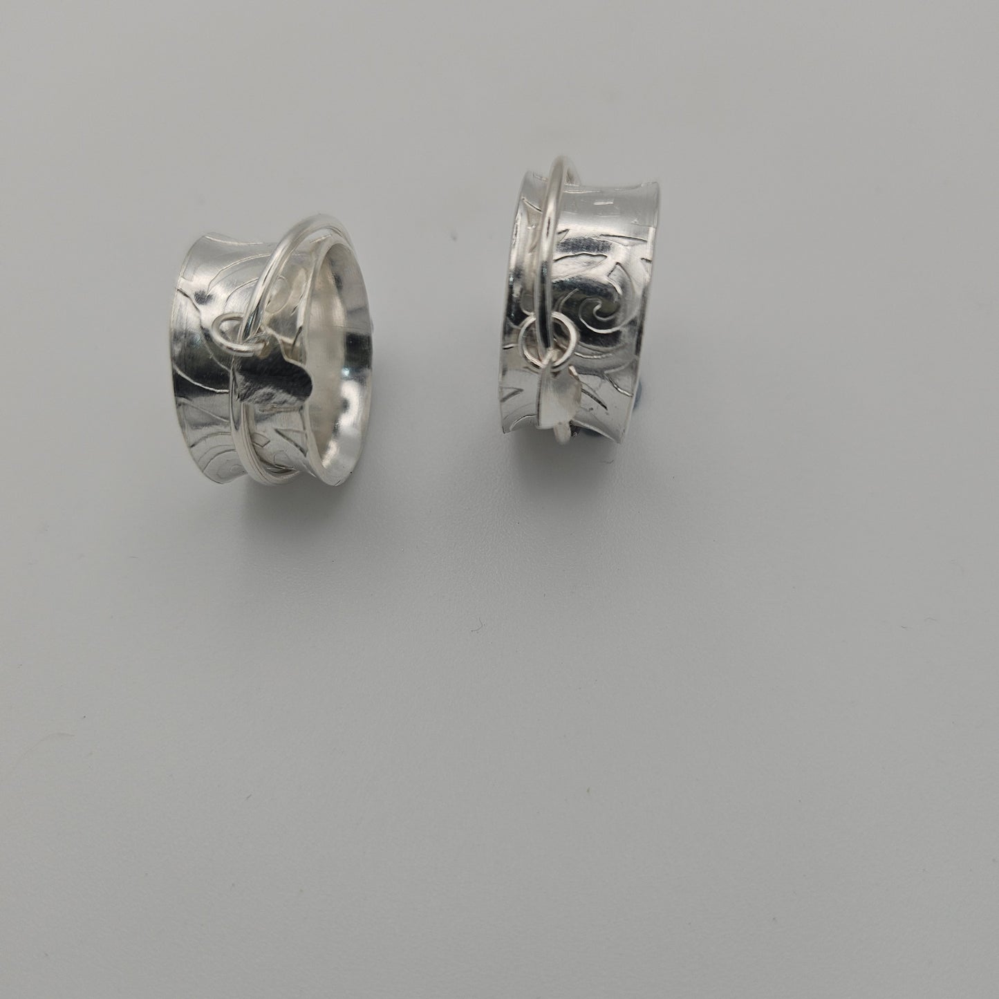 Sterling silver spinner rings. With a heart charm