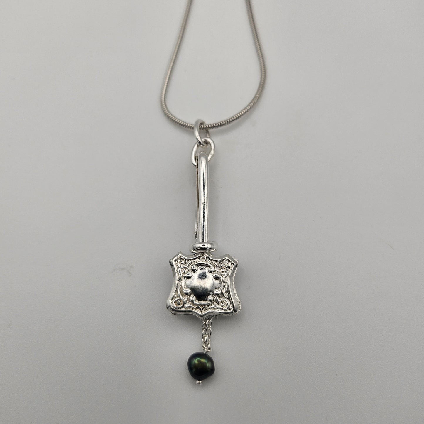 Sterling silver one of a kind pendant. Napkin clip