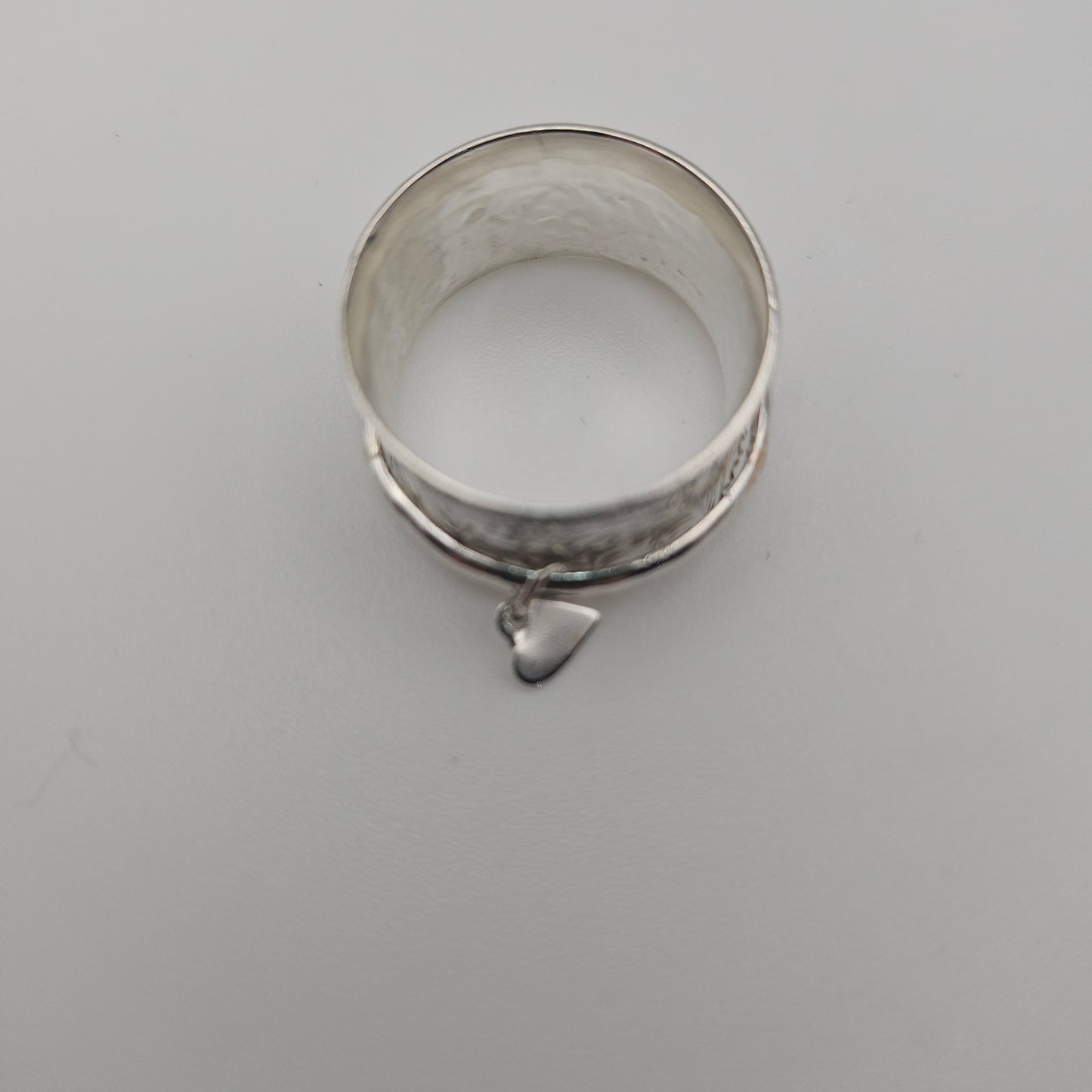 Sterling silver spinner ring. With love heart attached