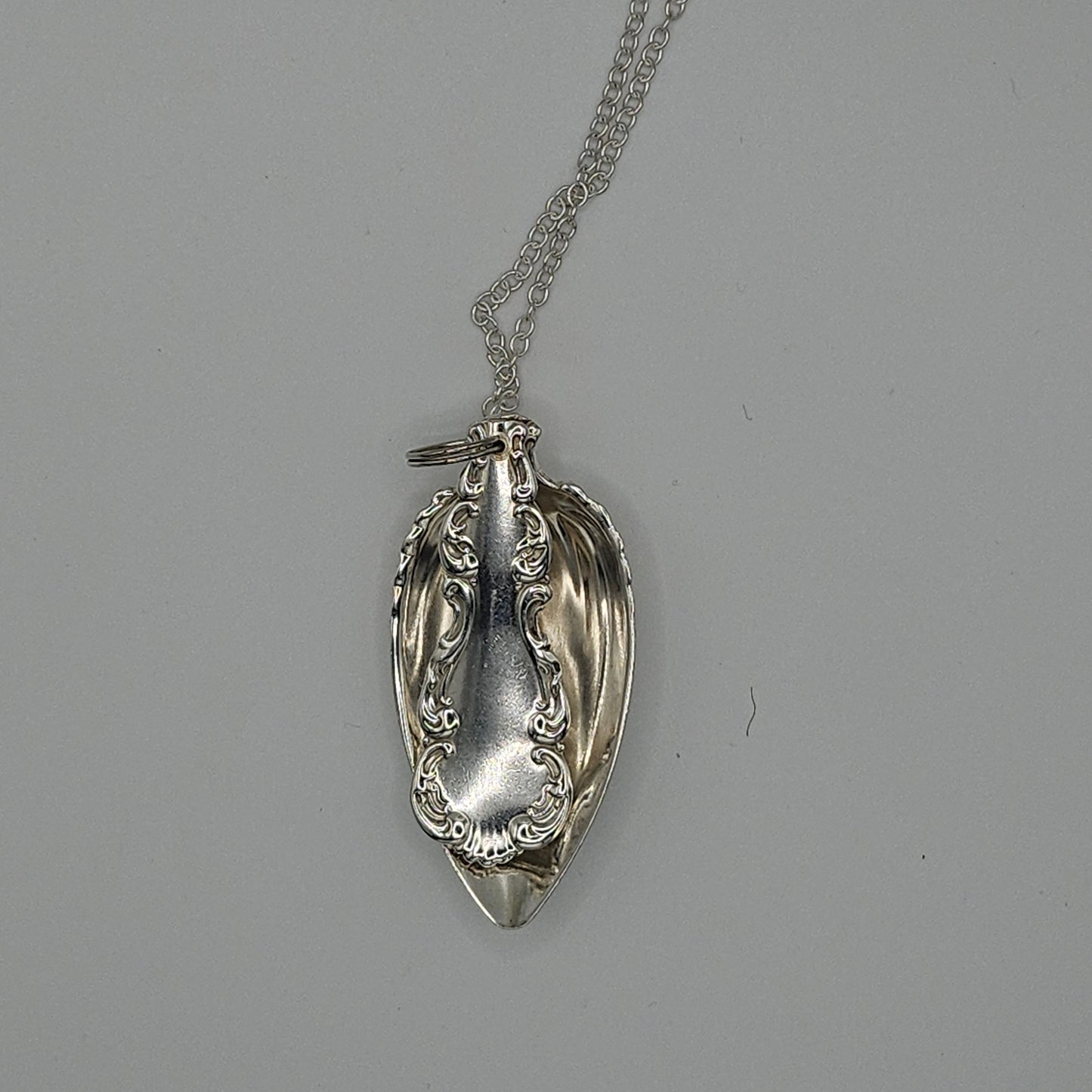 Sterling silver spoon pendant on a long chain