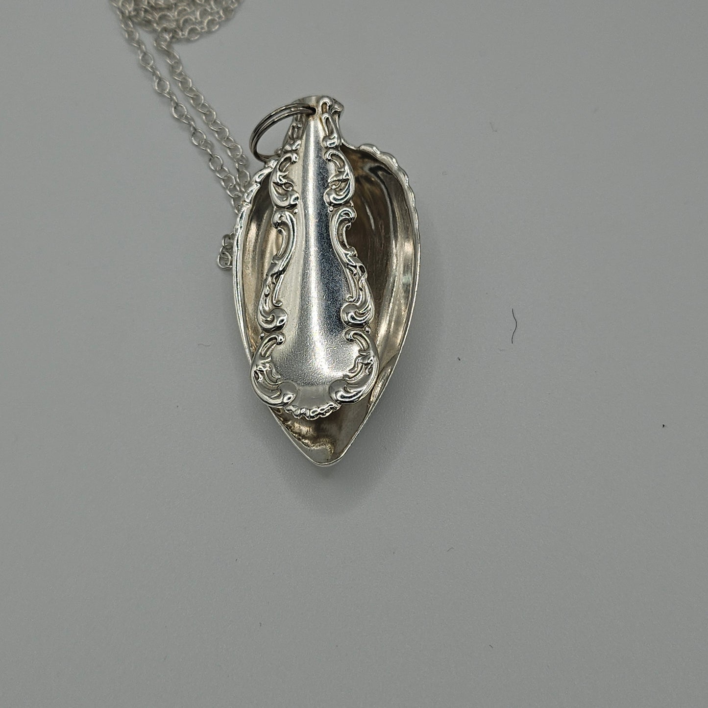 Sterling silver spoon pendant on a long chain