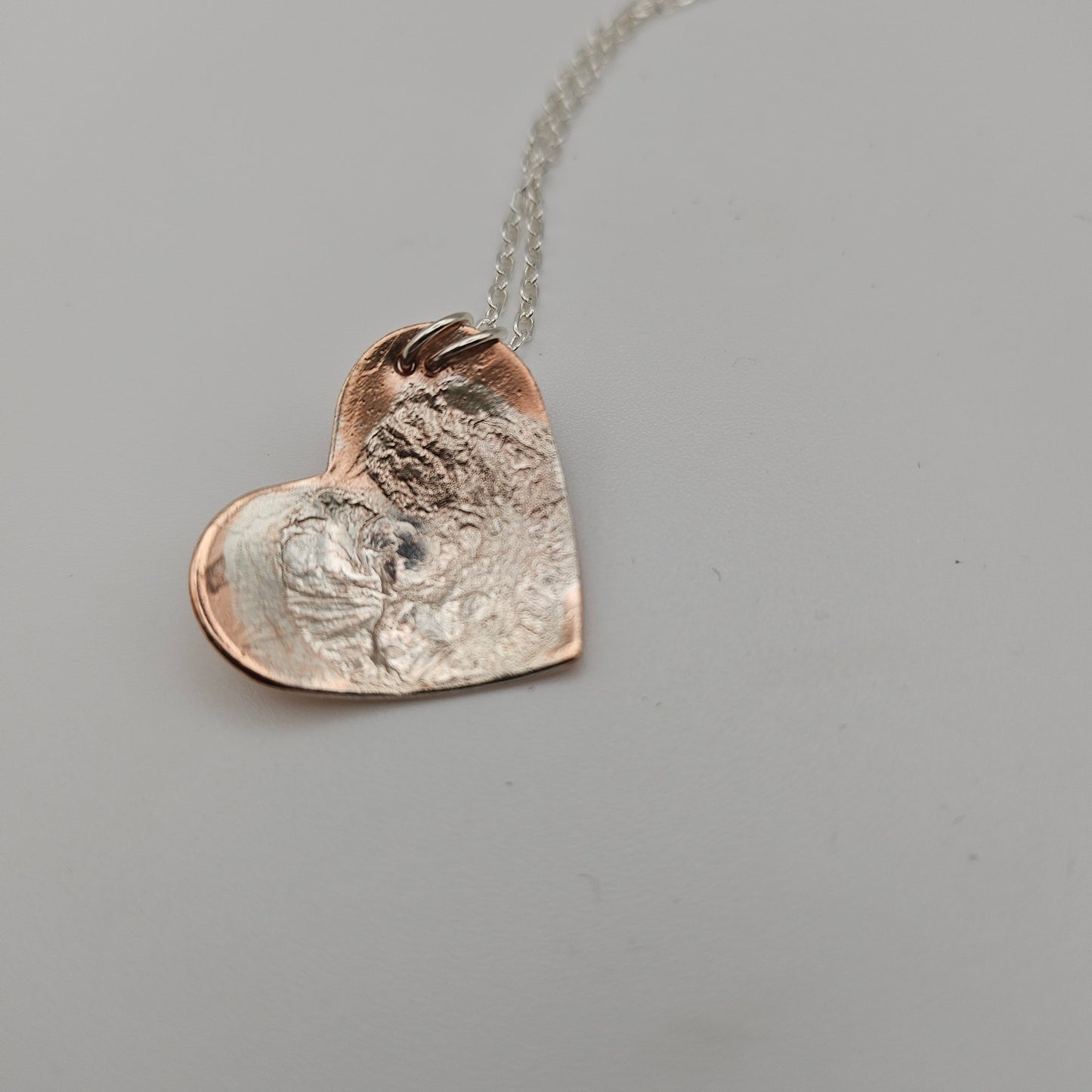 Sterling silver and copper love heart pendant