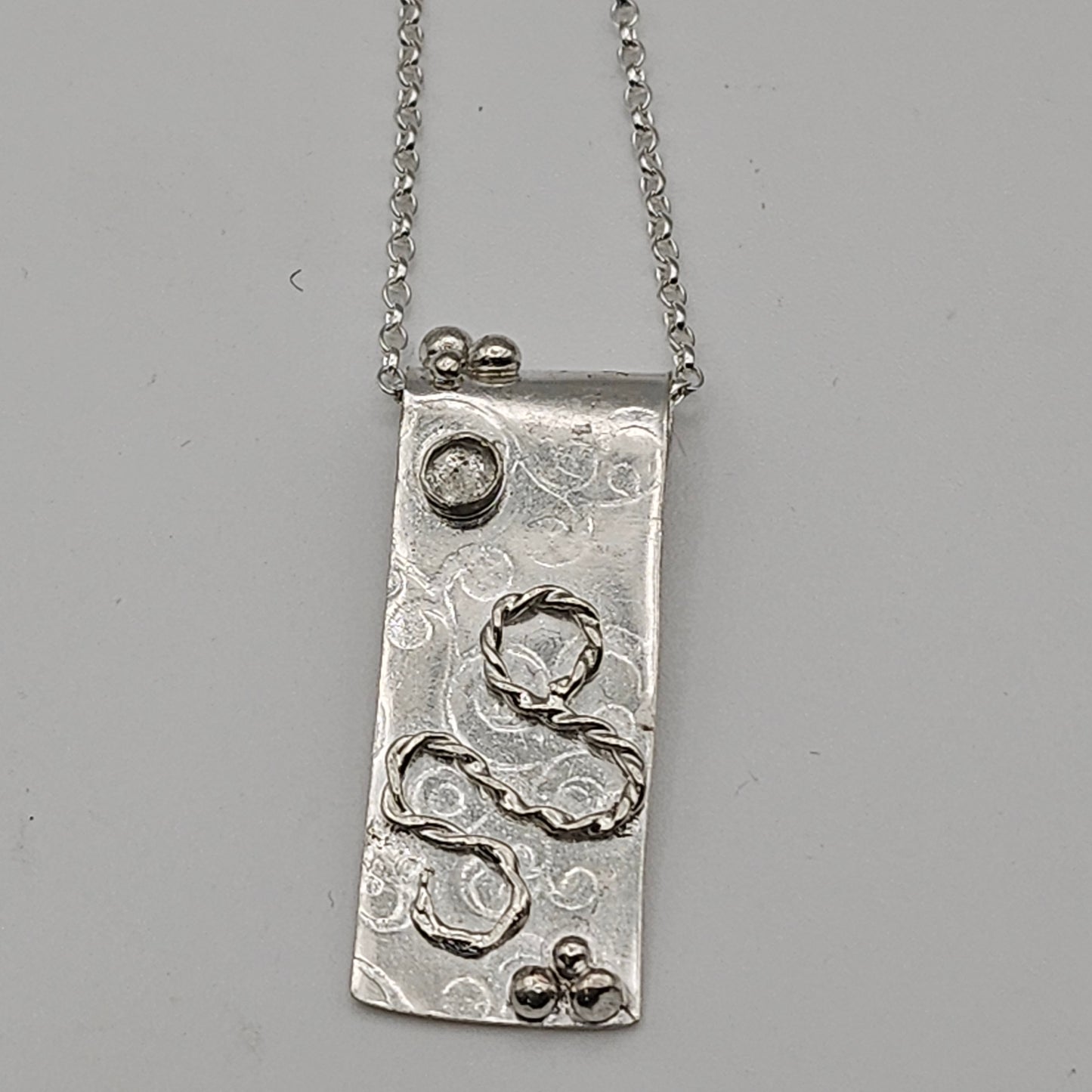 Sterling silver pendant with white topaz stone