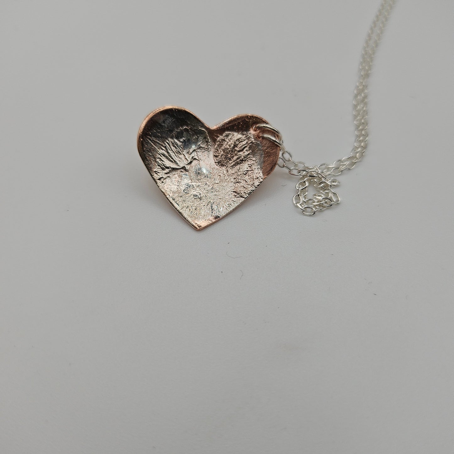 Sterling silver and copper love heart pendant