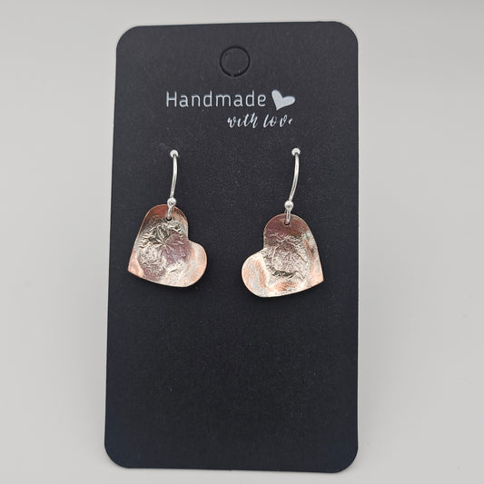 Sterling silver reticulated onto copper.  Love heart earrings