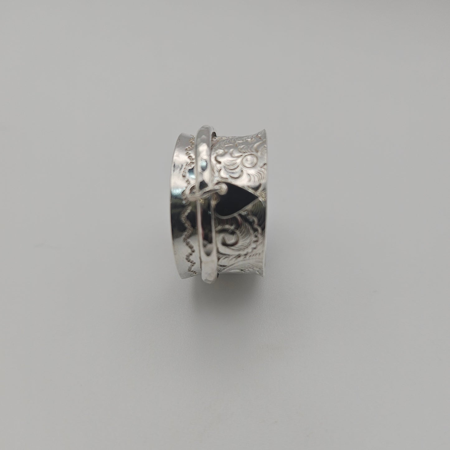 Sterling silver spinner ring. With love heart attached