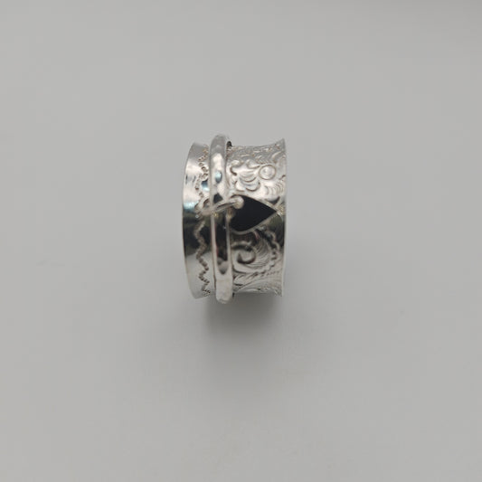Sterling silver spinner ring. With love heart attached