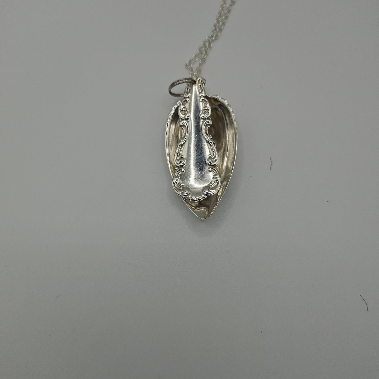 Sterling silver spoon pendant on a long chain
