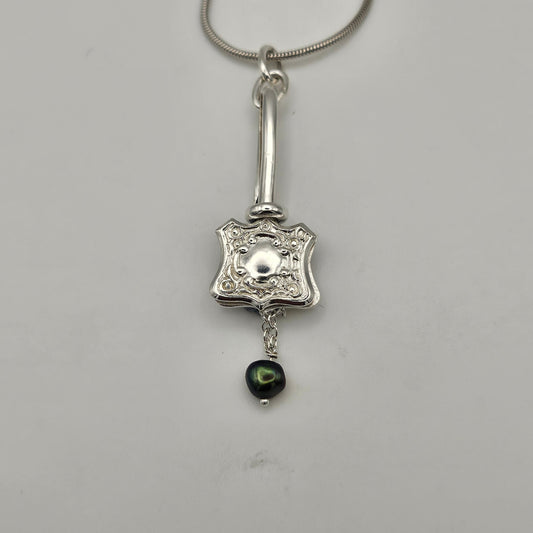 Sterling silver one of a kind pendant. Napkin clip