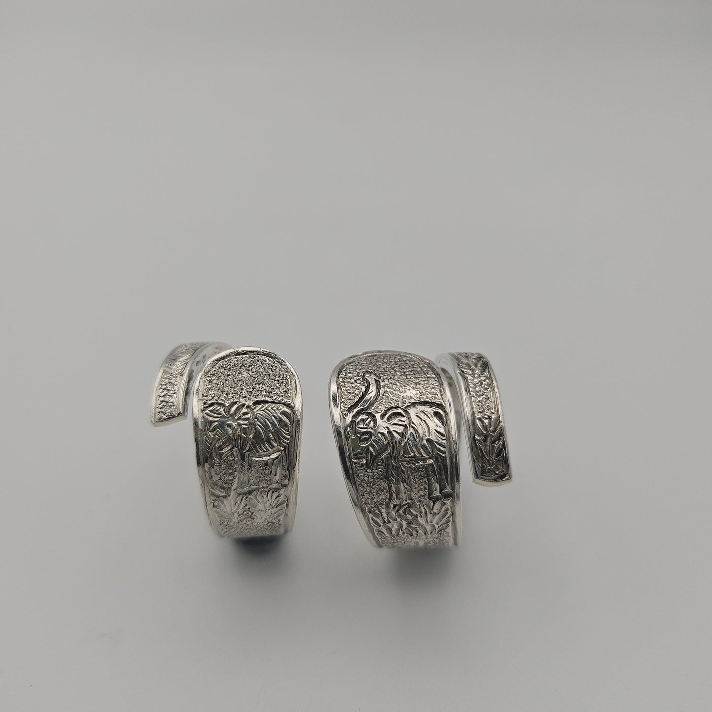 Sterling silver spoon handle spiral rings with elephant designs