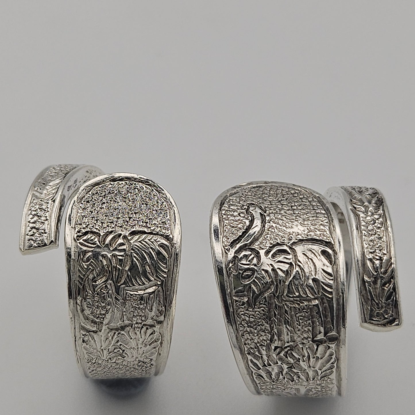 Sterling silver spoon handle spiral rings with elephant designs
